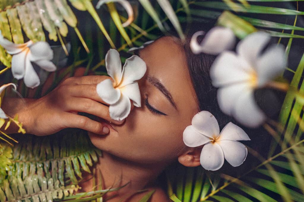 Lady with frangipani flower